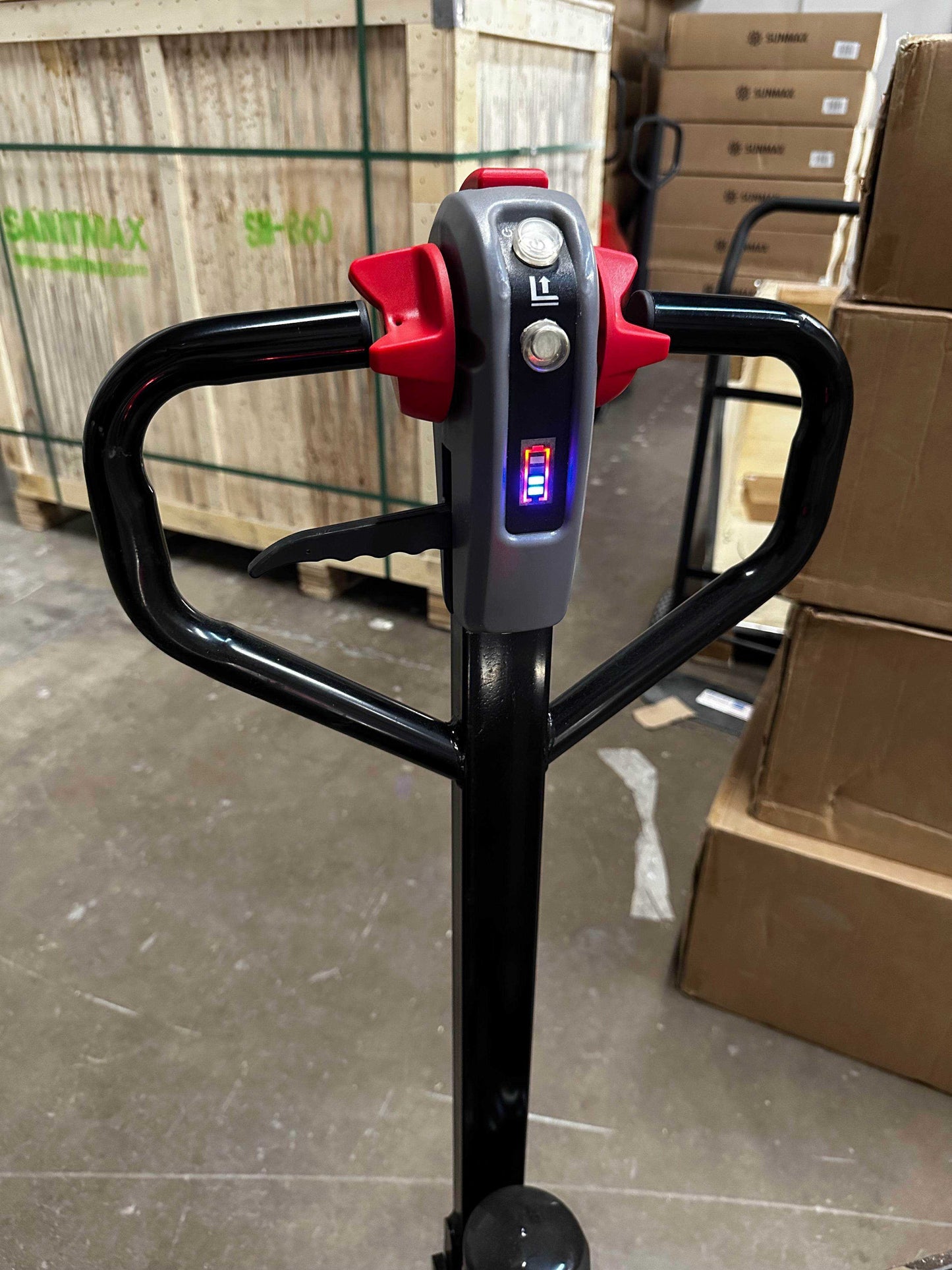 PT4400W Electric Pallet Jack handle with control buttons and LED indicator in warehouse setting