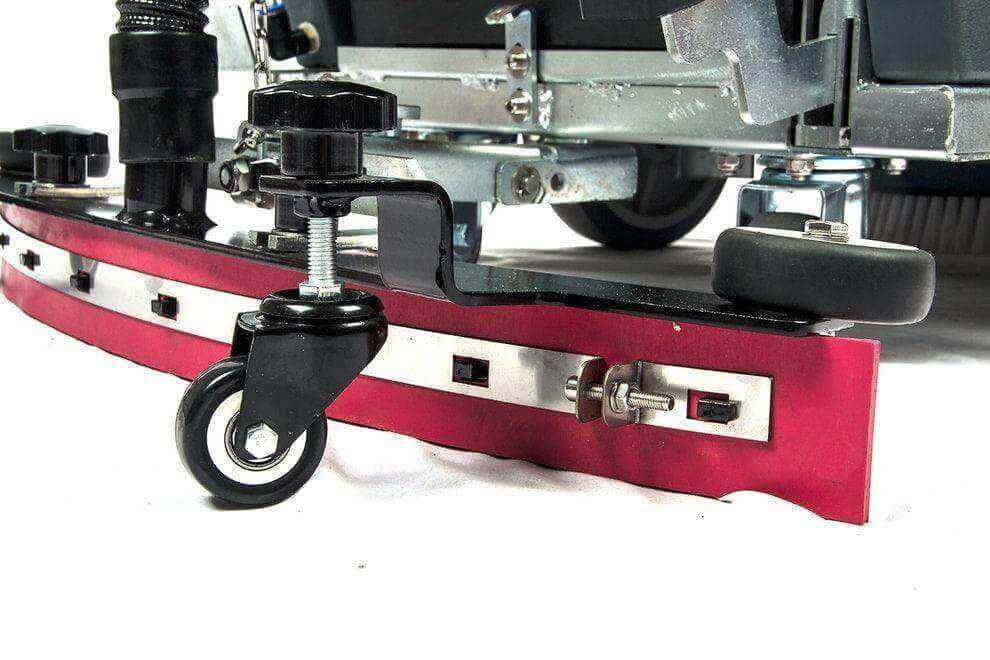Close-up of RT50 battery powered walk-behind floor scrubber's front caster wheel and squeegee assembly for efficient cleaning
