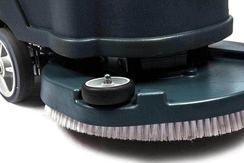 Close-up of RT50 battery powered walk-behind floor scrubber brush and wheels with 22-inch cleaning path