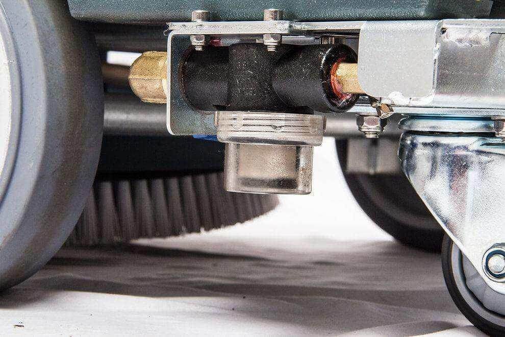 close-up of RT50 battery powered walk-behind floor scrubber brush and wheel detailing
