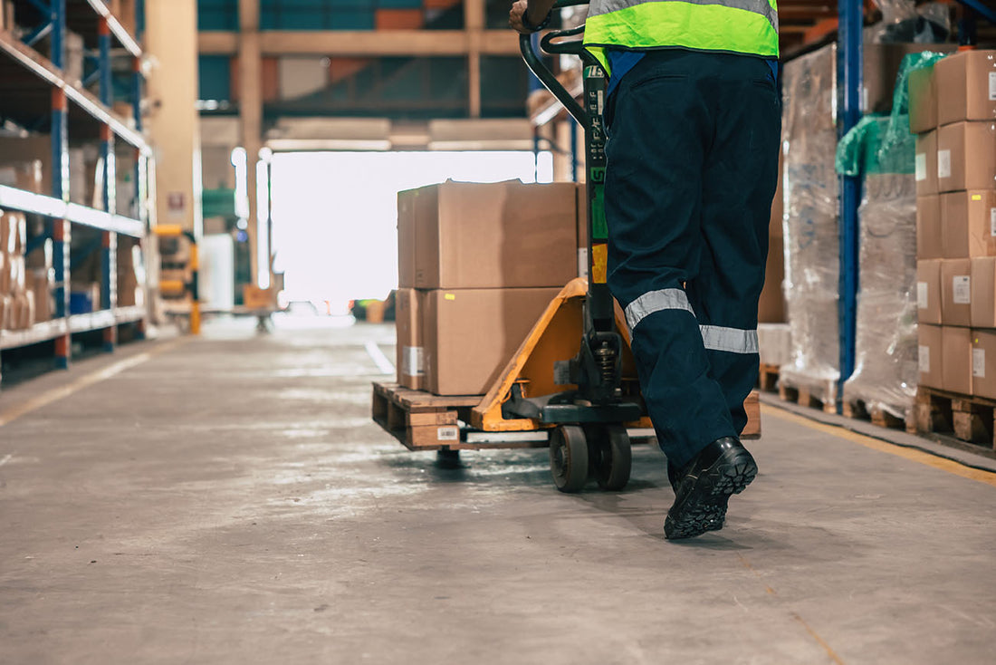 A warehouse employee performing material handler duties.